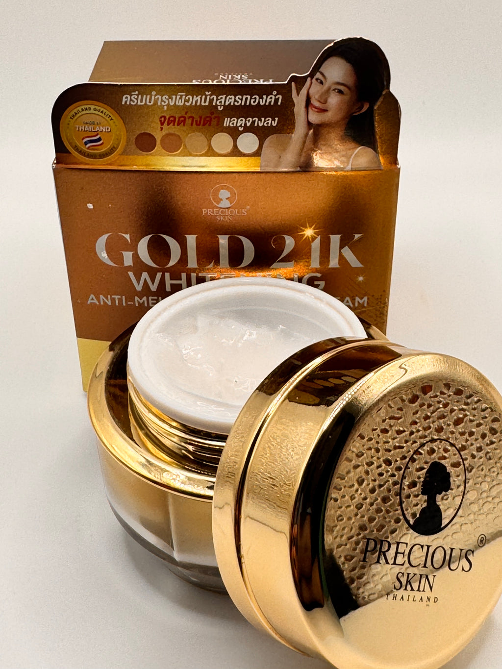 "Precious Skin Gold 24K Anti-Melasma Cream jar open showing rich golden cream texture for even, luminous skin"