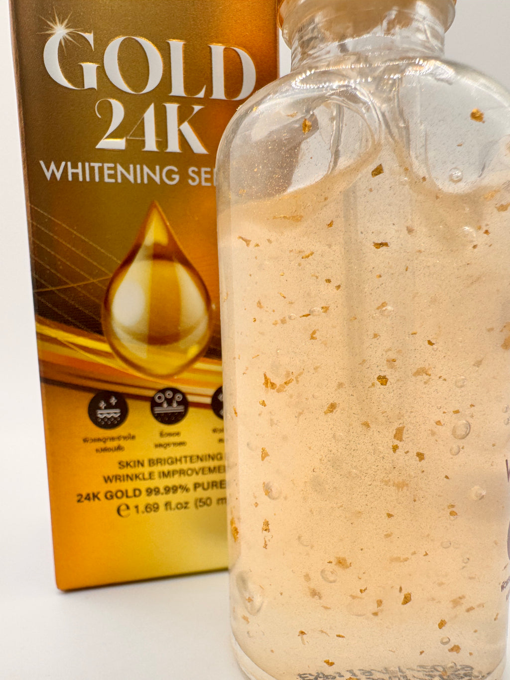 "Precious Skin Gld 24K Serum bottle showing golden formula with 24K gold particles for radiant, youthful, and even-toned skin"
