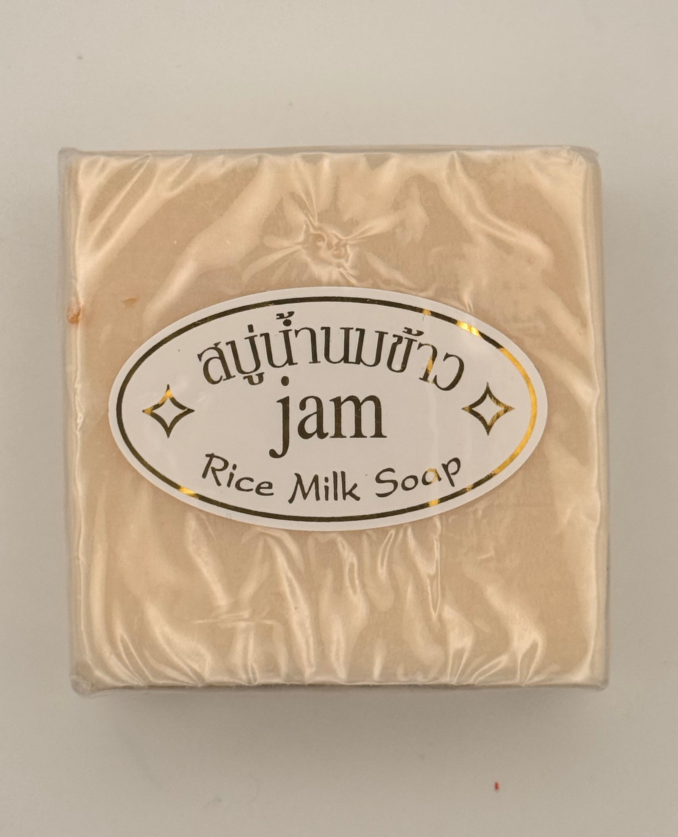 "Jam Rice Milk Soap bars unwrapped showing creamy rice milk texture for brightening face and body"
